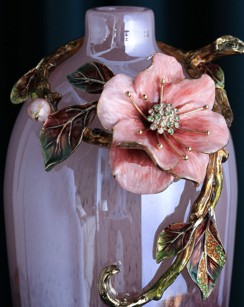 A decorative pink glass vase with a large pink flower and gold-toned vine embellishment, shown against a dark background with the text 'PRODUCT DETAILS' and Chinese characters at the top.